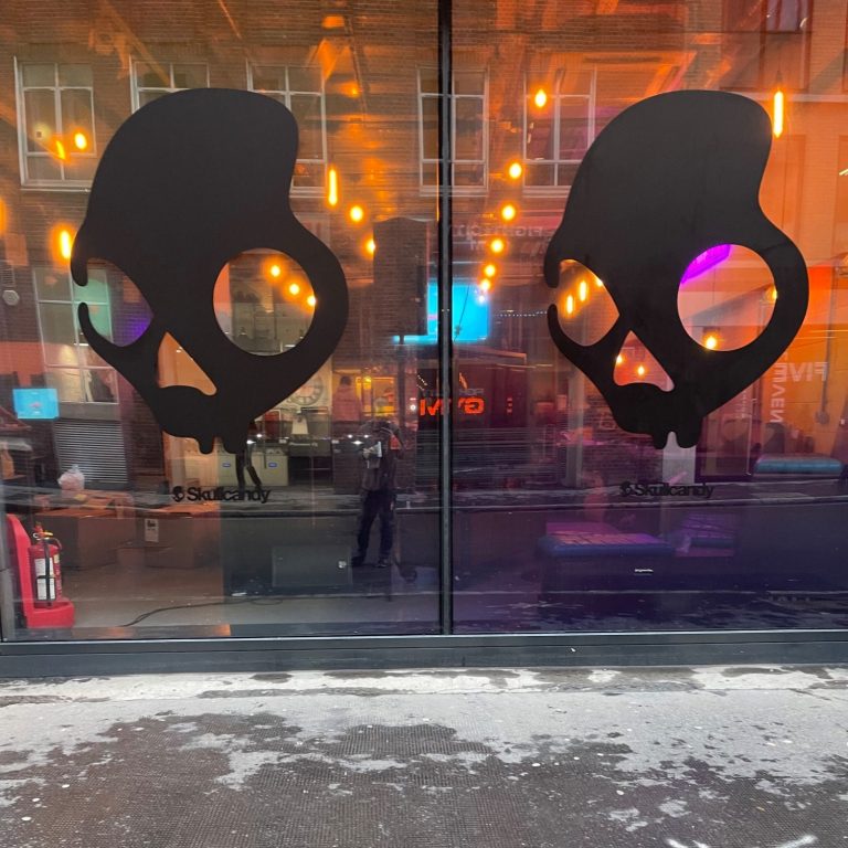 Skull Candy Shop Front Installations | The Vinyl Bay Vinyl graphic installation on shop front with skull candy logos.
